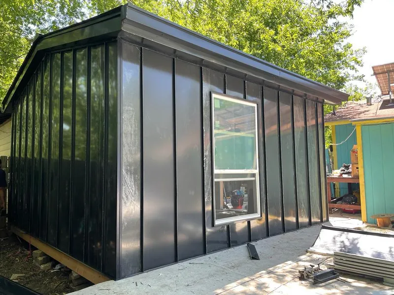 Black standing seam metal wall panels for Roof Inspection in Maize